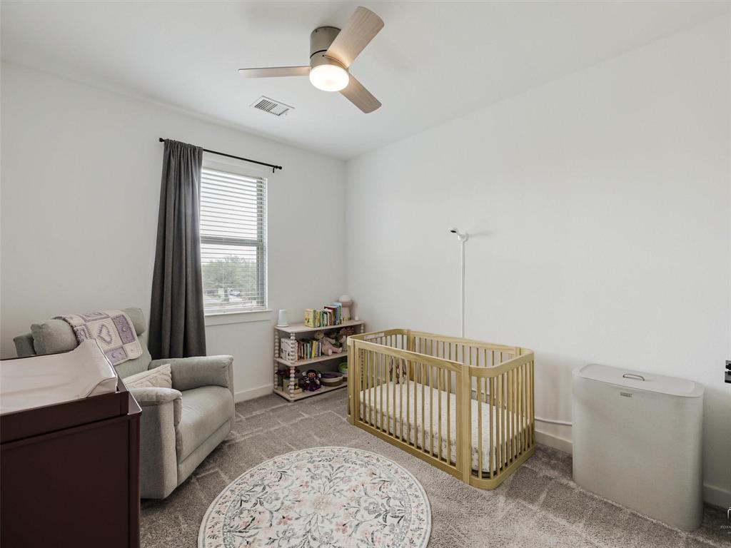 5912 Ridgeline Drive McKinney, TX 75070 - Photo 14 of 22 a bedroom with furniture and window