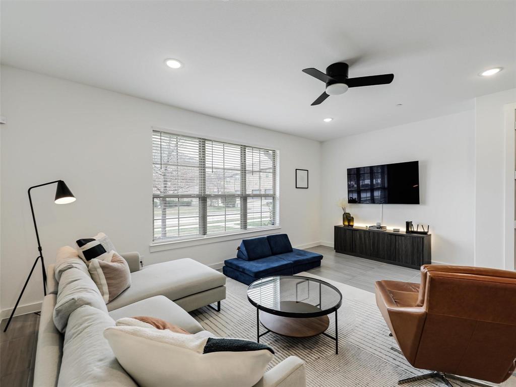 5912 Ridgeline Drive McKinney, TX 75070 - Photo 3 of 22 a living room with furniture and a flat screen tv