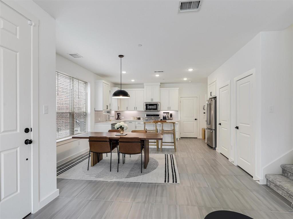 5912 Ridgeline Drive McKinney, TX 75070 - Photo 6 of 22 a view of a dining room with furniture and wooden floor