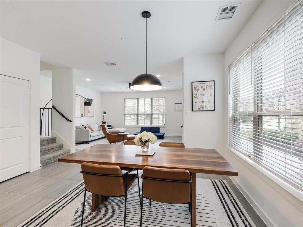 5912 Ridgeline Drive McKinney, TX 75070 - Photo 7 of 22 a view of a dining room with furniture window and wooden floor