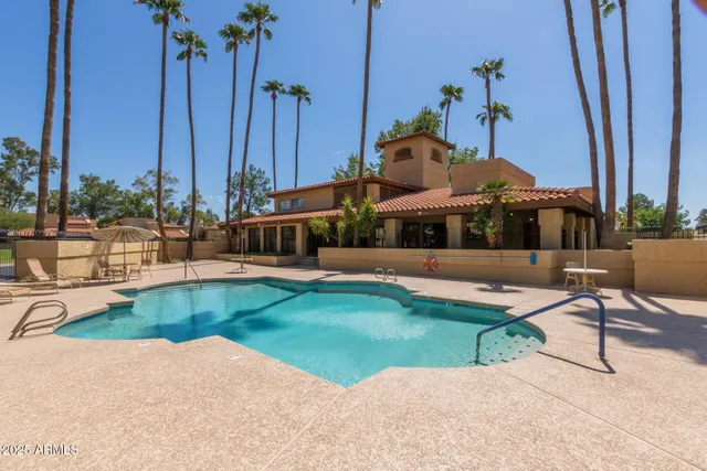 a spacious bathroom with a glass shower door and a mirror