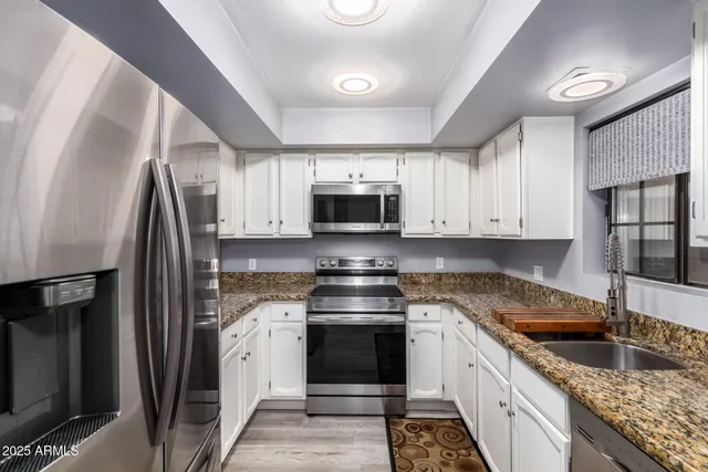 a kitchen with a stove microwave and refrigerator