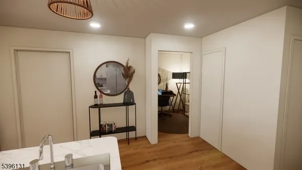 a bedroom with a bed a mirror and closet