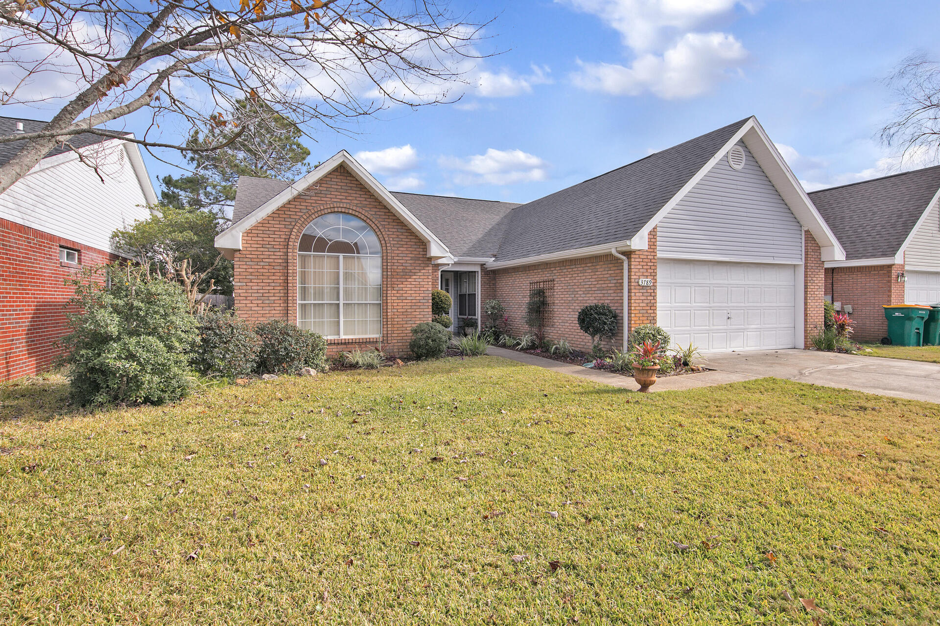 3789 Misty Way Destin, FL 32541 - Photo 3 of 29 a house view with a garden space