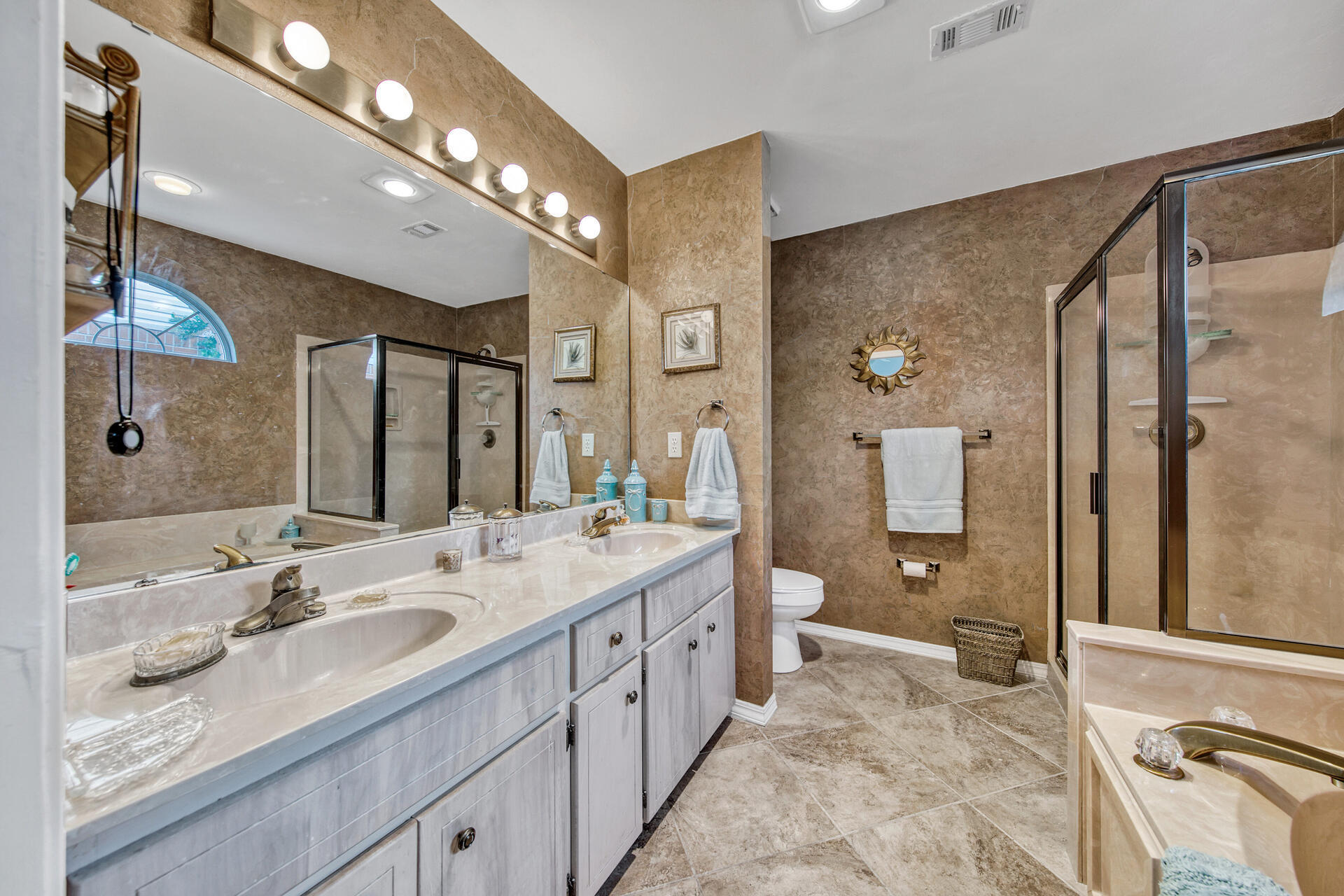 3789 Misty Way Destin, FL 32541 - Photo 23 of 29 a spacious bathroom with a sink double vanity and a mirror
