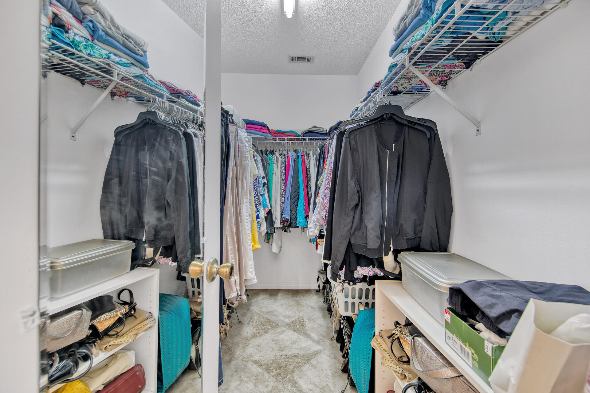 3789 Misty Way Destin, FL 32541 - Photo 25 of 29 a view of walk in closet with clothes and shoes