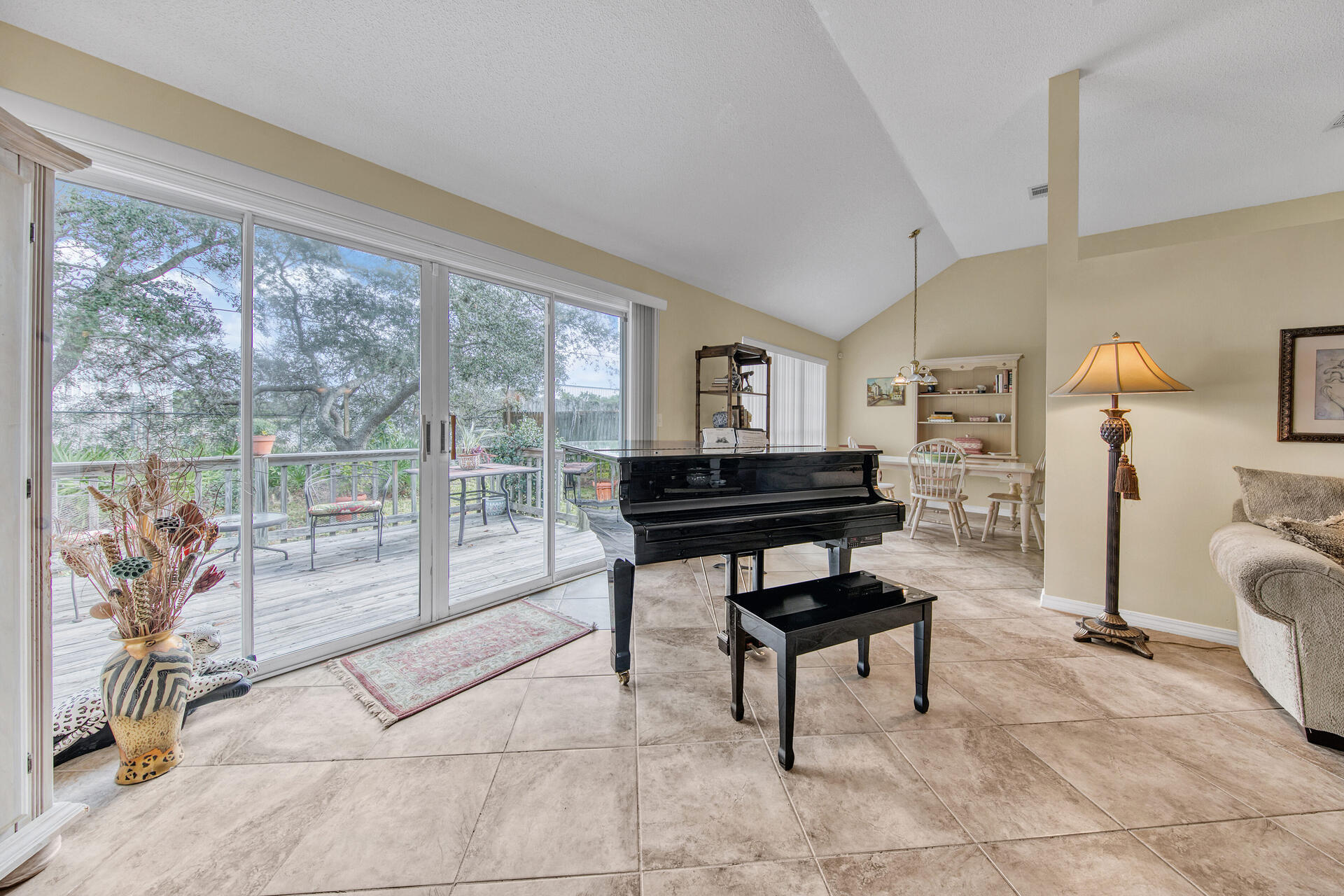 3789 Misty Way Destin, FL 32541 - Photo 7 of 29 a living room with furniture a lamp and a potted plant