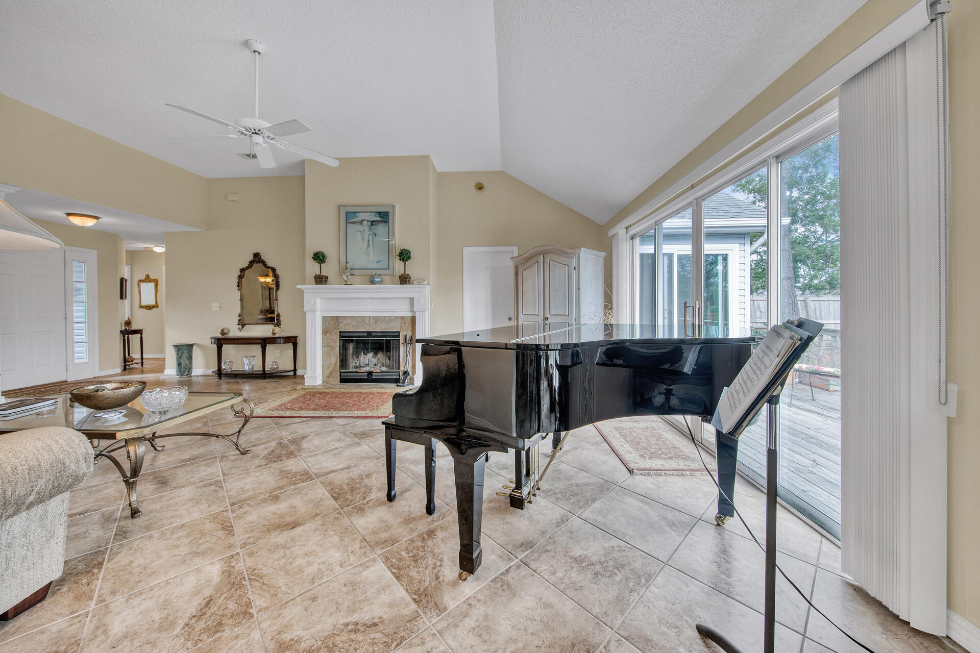 3789 Misty Way Destin, FL 32541 - Photo 8 of 29 a living room with furniture a fireplace and large windows