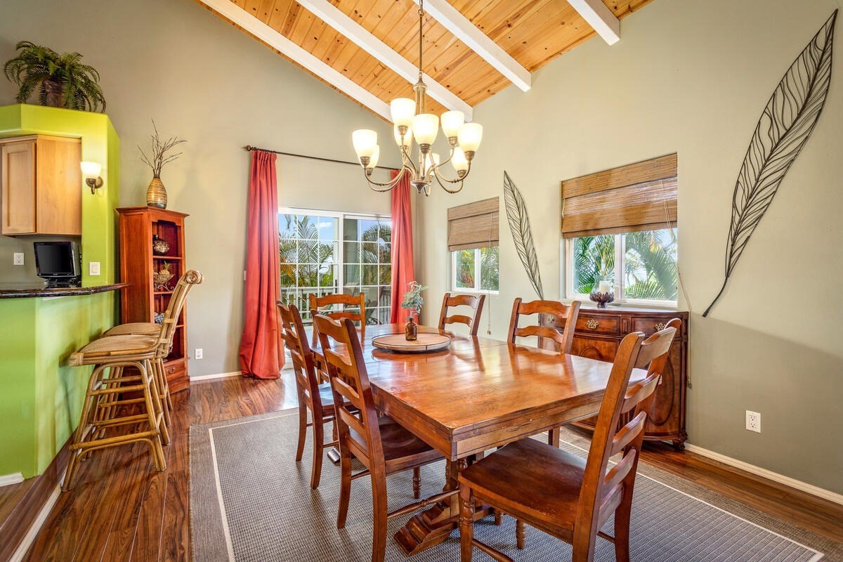 81-1073-i Captain Cook Road Captain Cook, HI 96704 - Photo 16 of 25 a dining room with furniture a chandelier and wooden floor