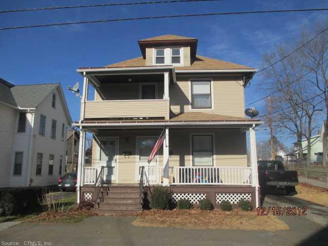 26 Church Street Ansonia, CT 06401 - Photo 1 of 1 a front view of a house with a garage