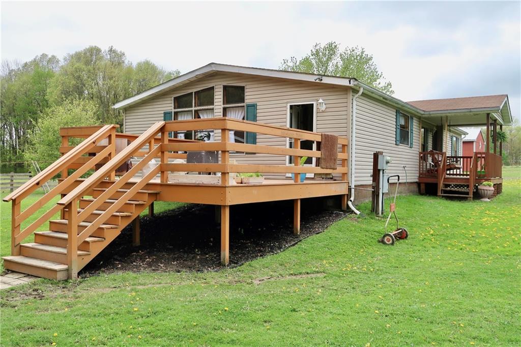 78 Balut Road Fredonia, PA 16124 - Photo 2 of 29 a front view of a house with a yard table and chairs