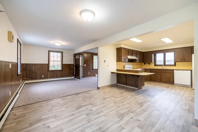 a large kitchen with a center island and counter space