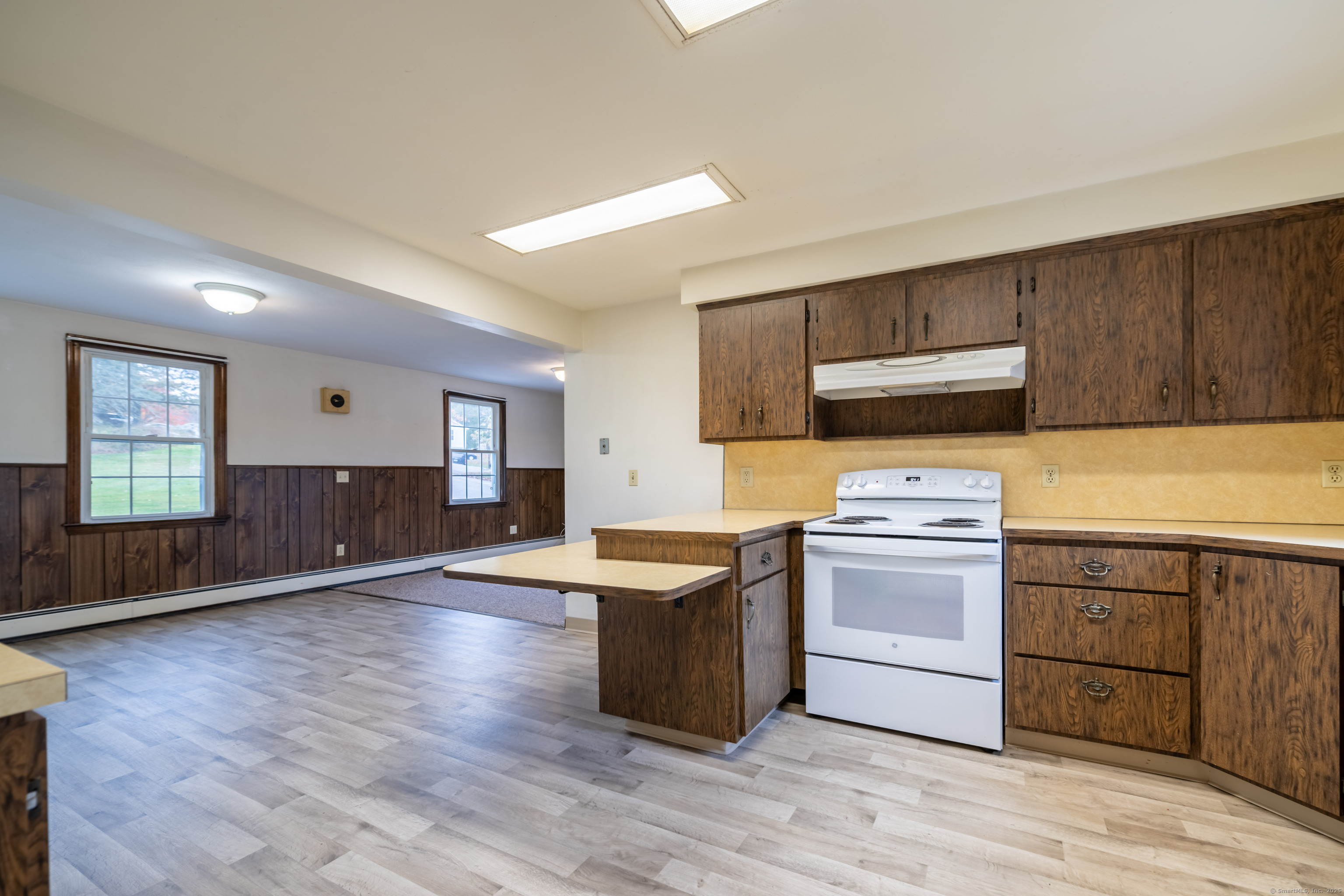 23 Waldo Road Norwich, CT 06360 - Photo 5 of 26 a kitchen with granite countertop a sink and steel appliances
