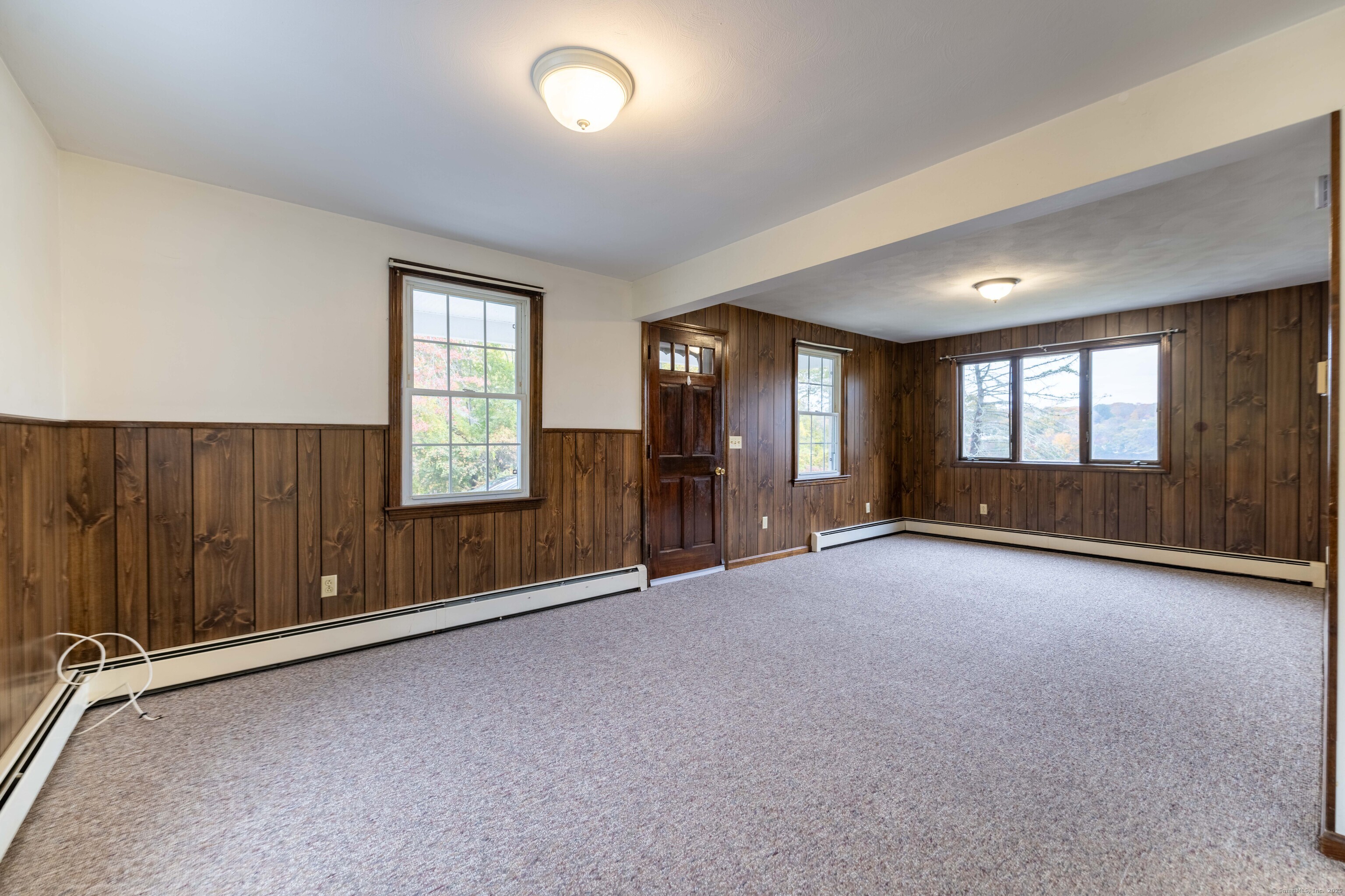 23 Waldo Road Norwich, CT 06360 - Photo 9 of 26 an empty room with windows