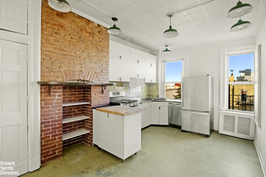 100 Newel Street, Unit 4L Brooklyn, NY 11222 - Photo 7 of 13 a kitchen with stainless steel appliances a stove and refrigerator