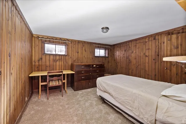 a bedroom with a bed and a furniture