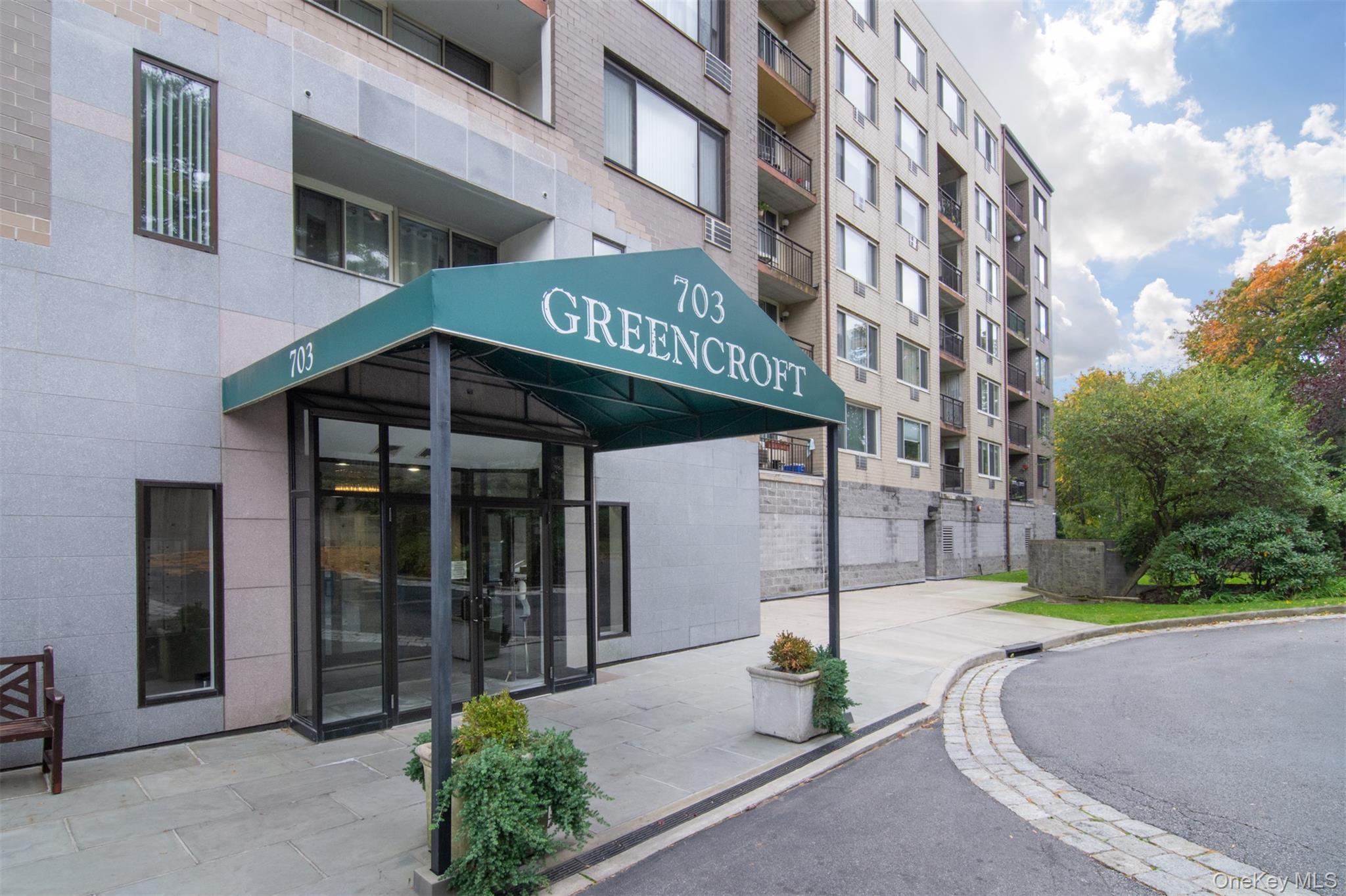 a view of a building with sitting area