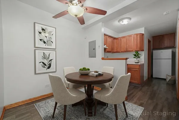 a view of a dining room with furniture and wooden floor