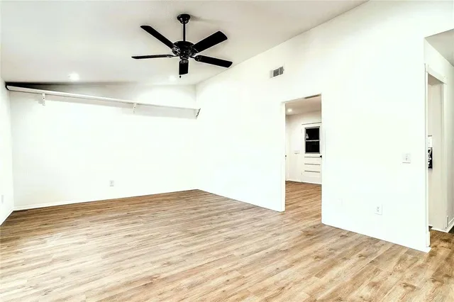 a view of a big room with wooden floor