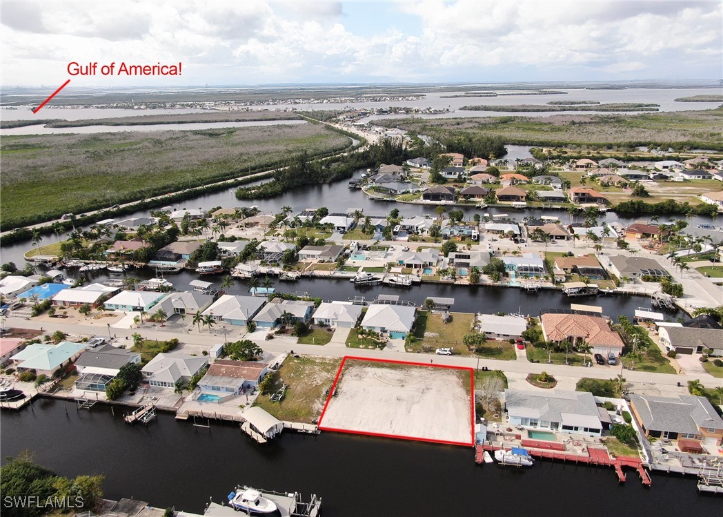12262 Moon Shell Drive Matlacha Isles, FL 33991 - Photo 1 of 11 an aerial view of residential houses with outdoor space