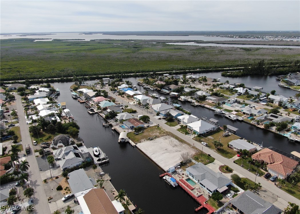 12262 Moon Shell Drive Matlacha Isles, FL 33991 - Photo 2 of 11 a view of a city with ocean view