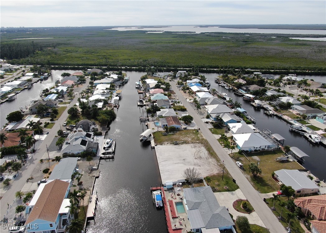 12262 Moon Shell Drive Matlacha Isles, FL 33991 - Photo 4 of 11 an aerial view of residential houses with outdoor space