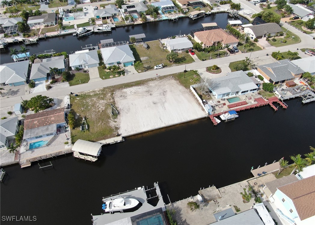 12262 Moon Shell Drive Matlacha Isles, FL 33991 - Photo 6 of 11 an aerial view of a house with a floor to ceiling window and outdoor space