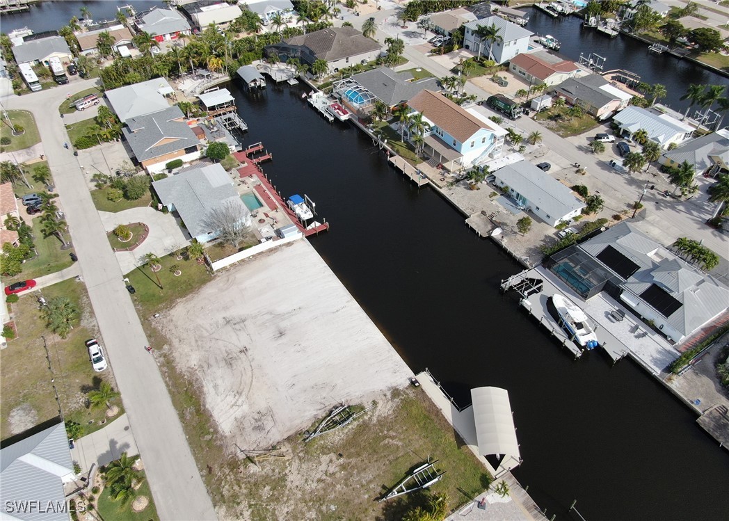 12262 Moon Shell Drive Matlacha Isles, FL 33991 - Photo 7 of 11 an aerial view of a house with a lake view