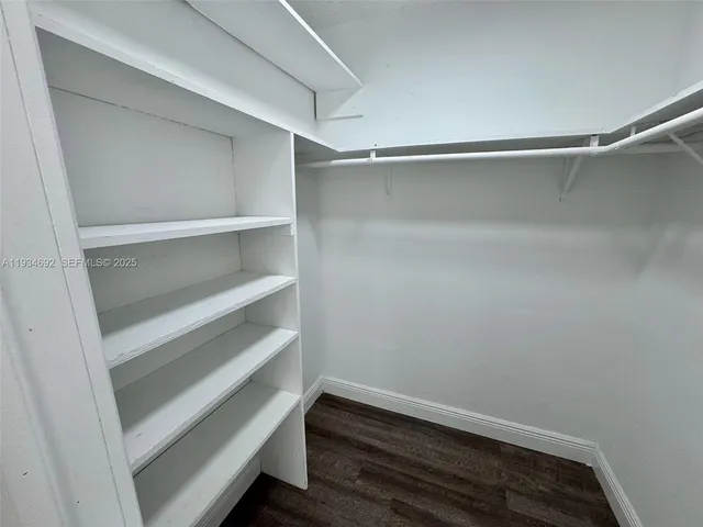 a view of an empty walk in closet