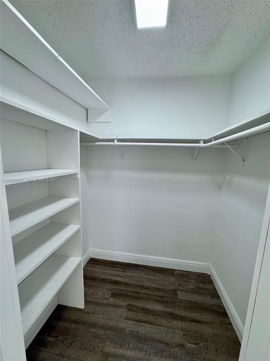 100 Southwest 9th Street, Unit B Hallandale Beach, FL 33009 - Photo 12 of 17 a view of an empty walk in closet