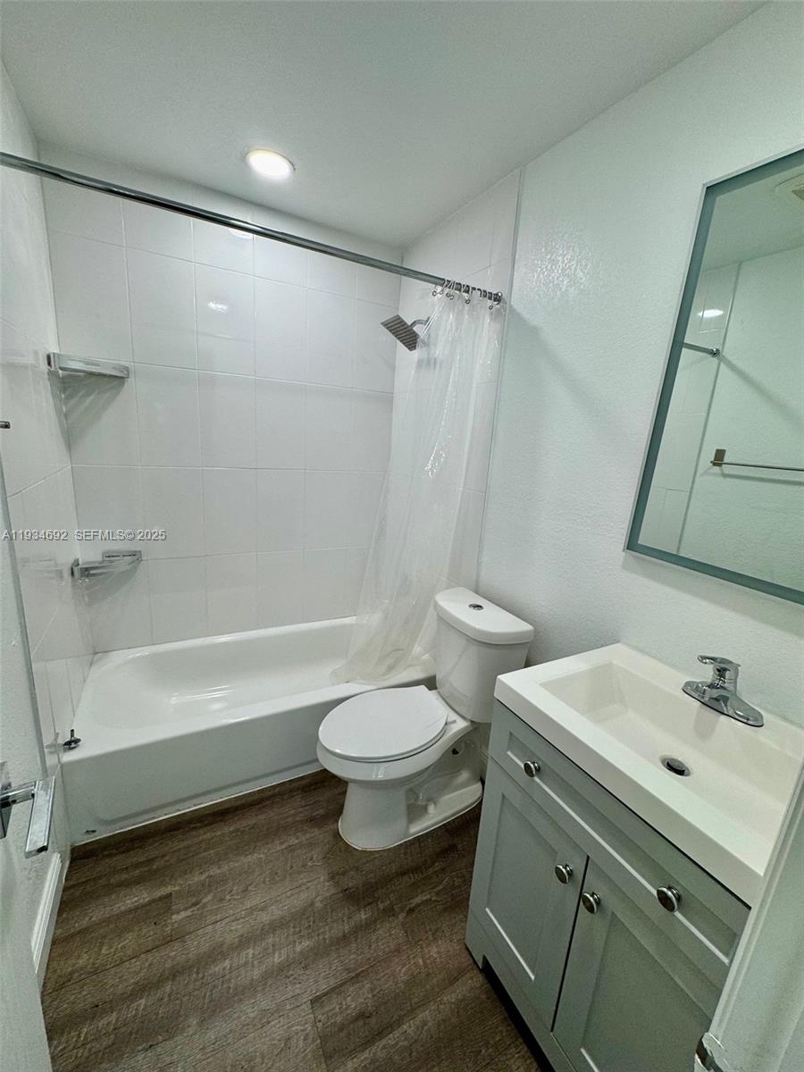 100 Southwest 9th Street, Unit B Hallandale Beach, FL 33009 - Photo 13 of 17 a bathroom with a sink toilet and shower