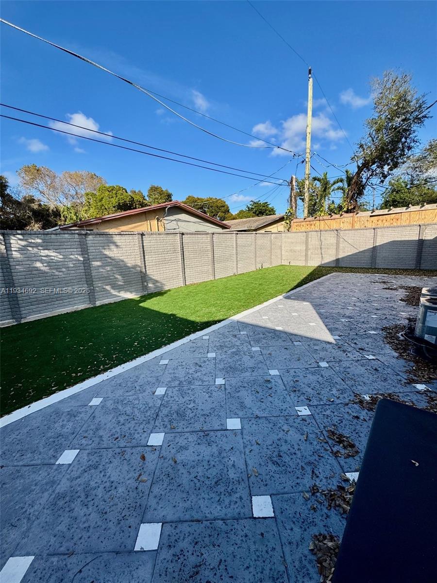100 Southwest 9th Street, Unit B Hallandale Beach, FL 33009 - Photo 16 of 17 a view of a backyard