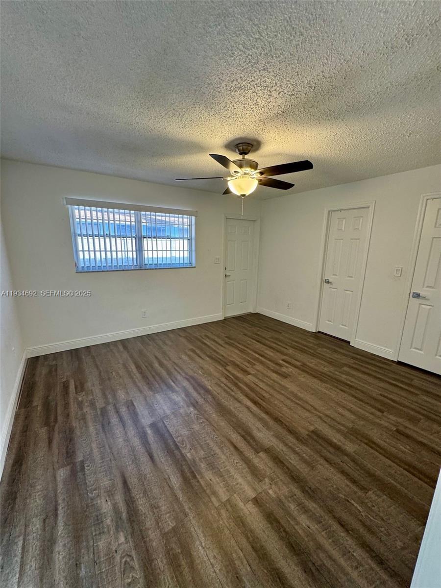 100 Southwest 9th Street, Unit B Hallandale Beach, FL 33009 - Photo 6 of 17 a view of an empty room with a window