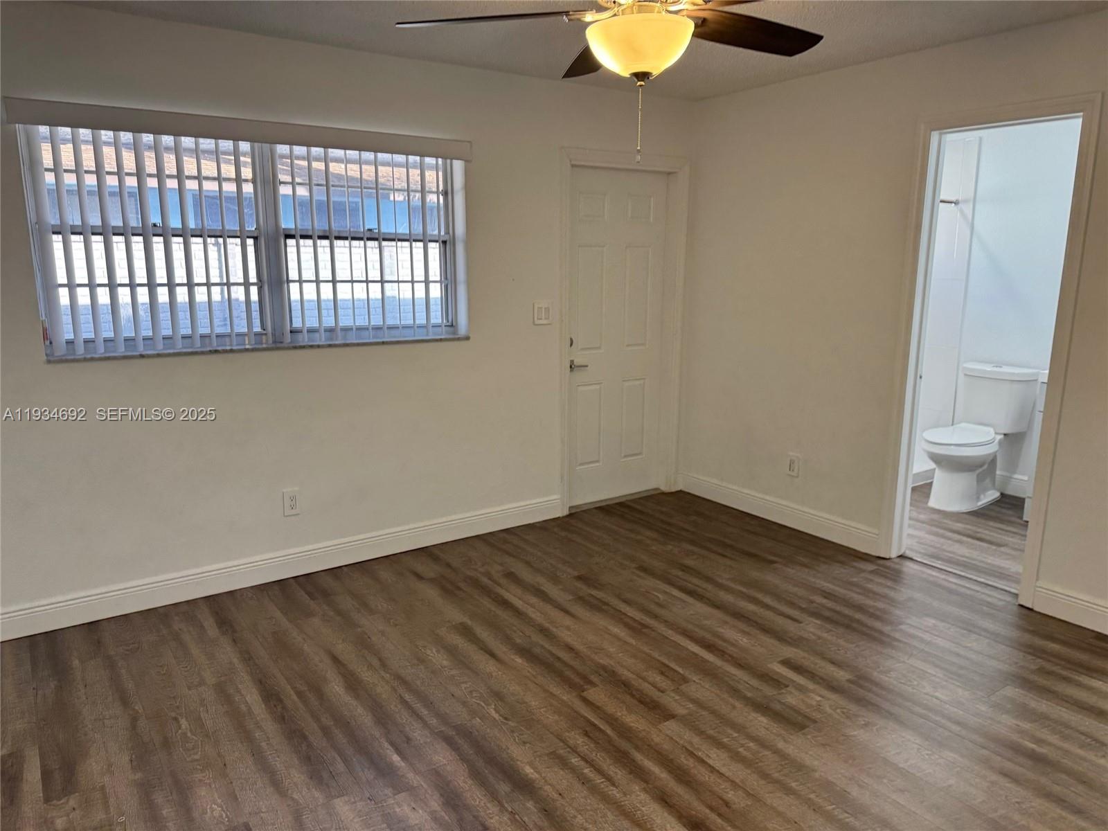 100 Southwest 9th Street, Unit B Hallandale Beach, FL 33009 - Photo 8 of 17 wooden floor in an empty room