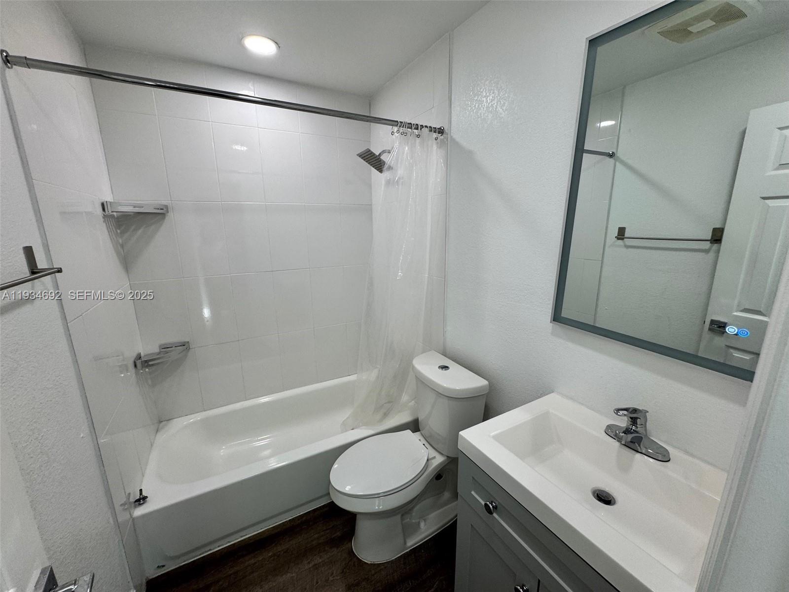 100 Southwest 9th Street, Unit B Hallandale Beach, FL 33009 - Photo 10 of 17 a bathroom with a sink toilet and shower