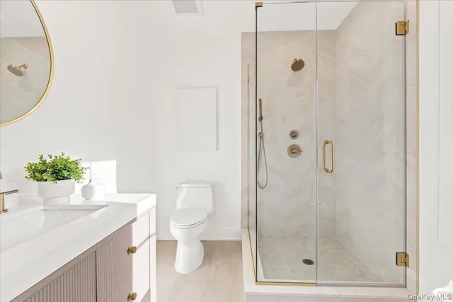 a bathroom with a shower and a sink