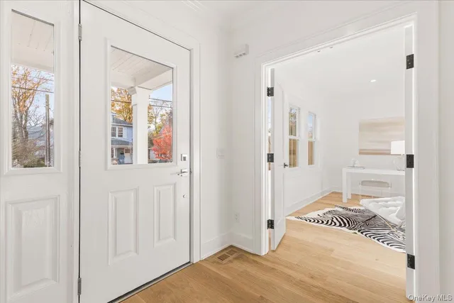 a bedroom with a bed and a mirror