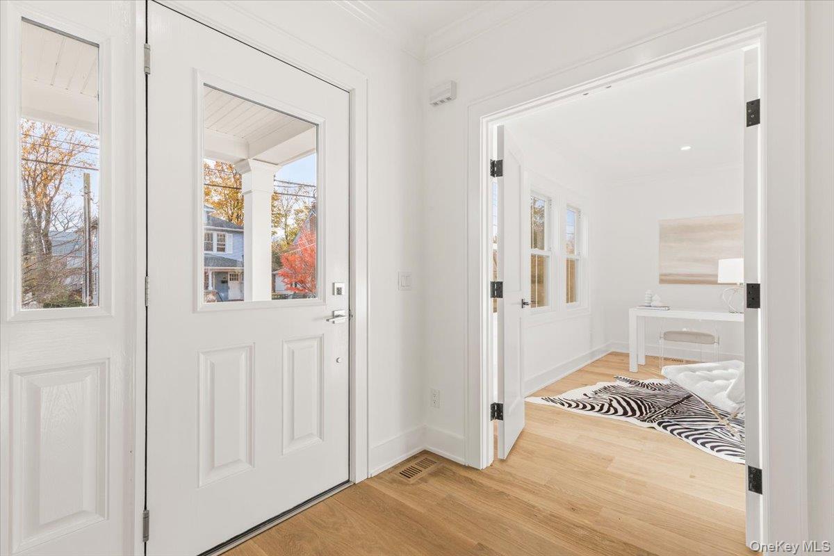 60 Grapal Street Rye, NY 10580 - Photo 2 of 36 a bedroom with a bed and a mirror