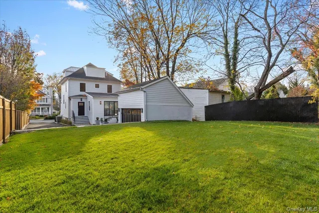 a view of a chairs and table in the balcony