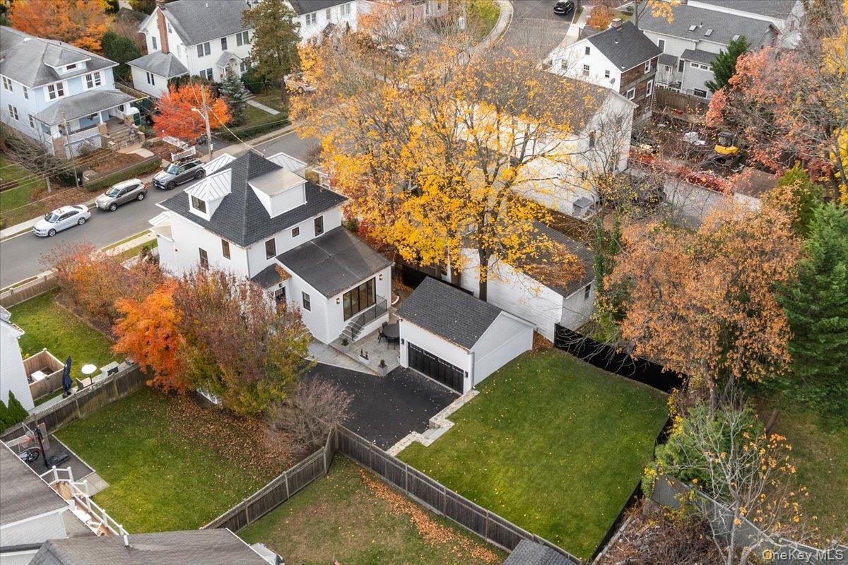 60 Grapal Street Rye, NY 10580 - Photo 28 of 36 an aerial view of a house with swimming pool and lake view