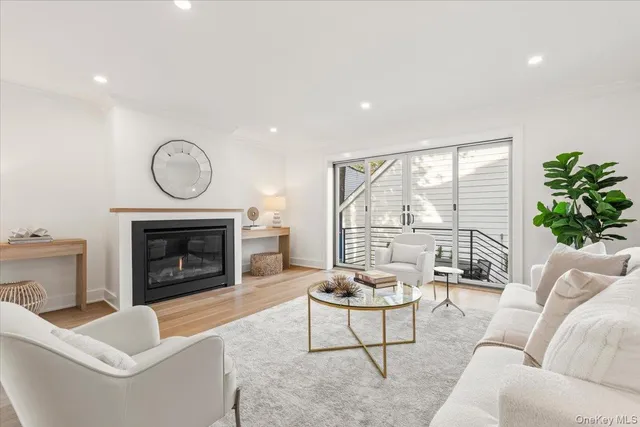 a living room with furniture a fireplace and a fireplace