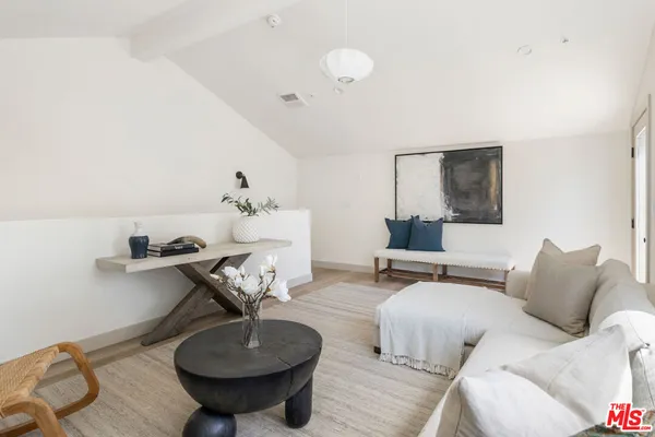 a living room with furniture and a table