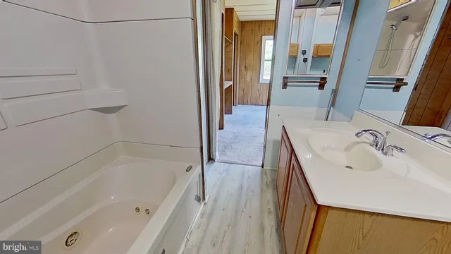 a bathroom with a bathtub and a sink
