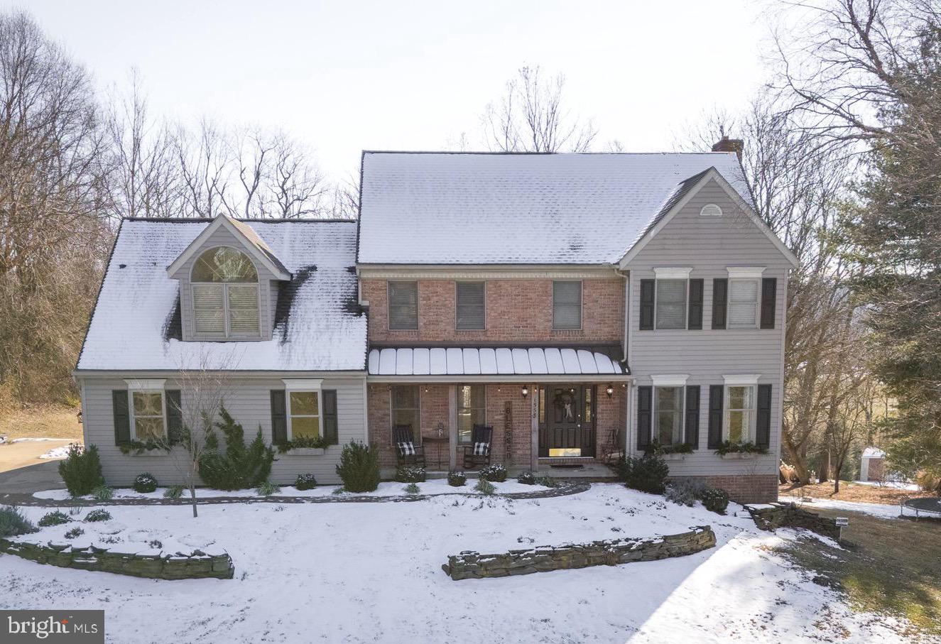1553 White Oak Road Strasburg, PA 17579 - Photo 1 of 52 a front view of a house with a yard