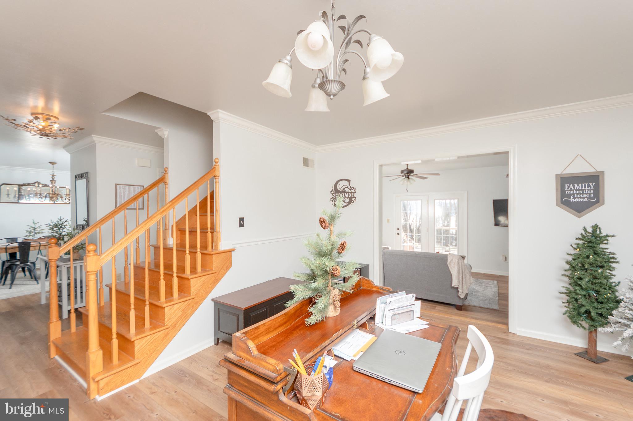 1553 White Oak Road Strasburg, PA 17579 - Photo 11 of 52 a living room with furniture chandelier and a chandelier