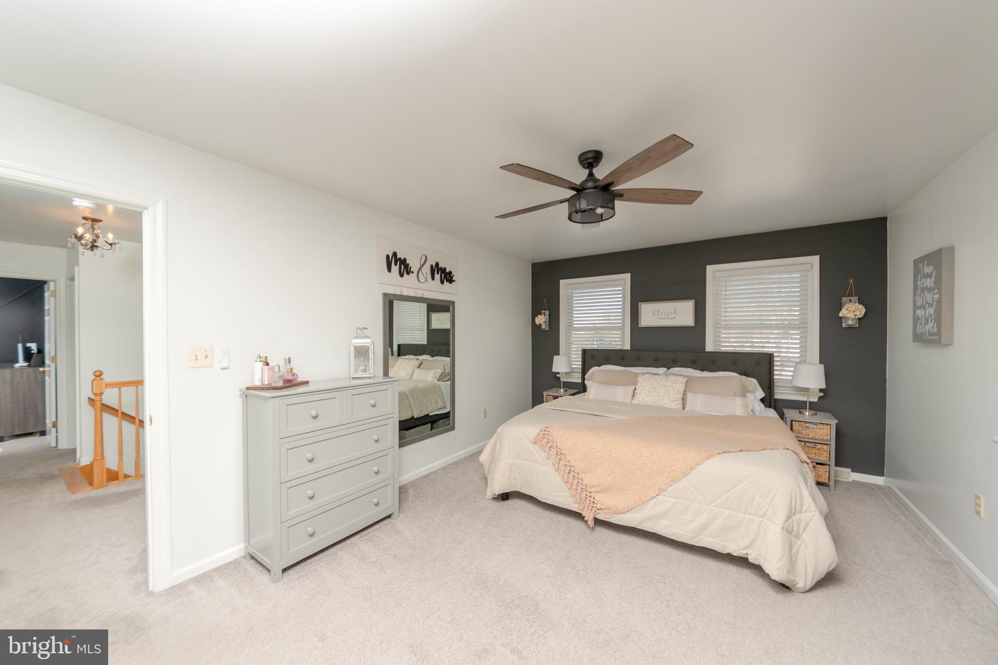 1553 White Oak Road Strasburg, PA 17579 - Photo 15 of 52 a bedroom with a bed and a chandelier