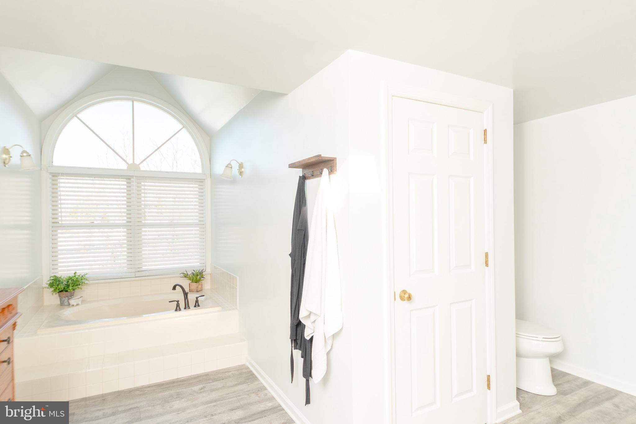1553 White Oak Road Strasburg, PA 17579 - Photo 20 of 52 a bathroom with a bathtub a sink and a window