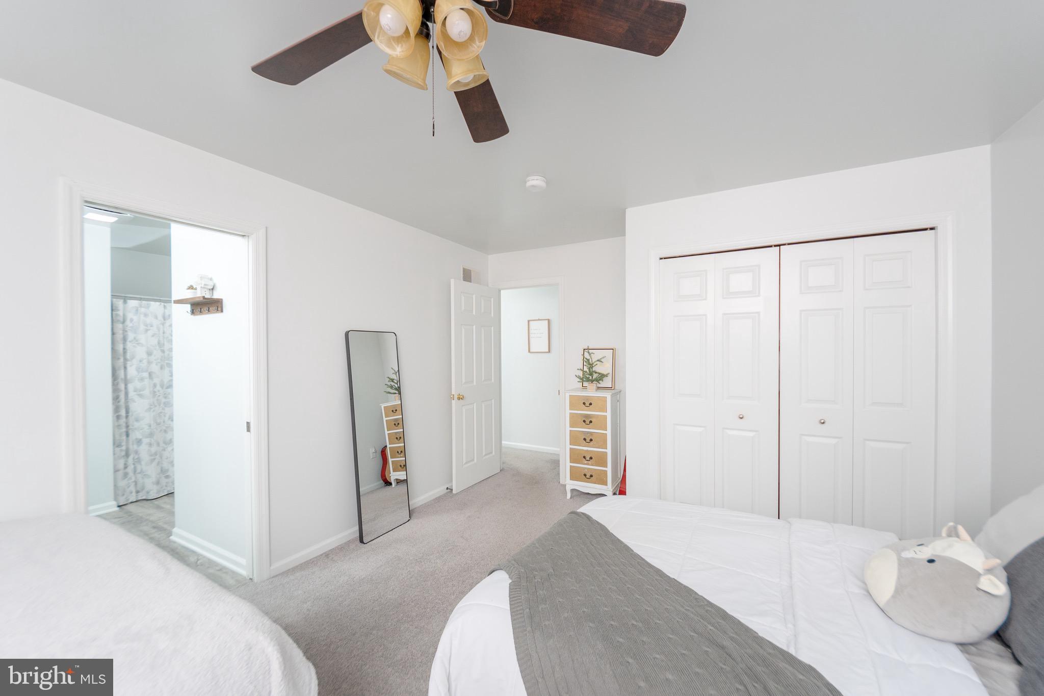 1553 White Oak Road Strasburg, PA 17579 - Photo 25 of 52 a bedroom with a bed and a chandelier