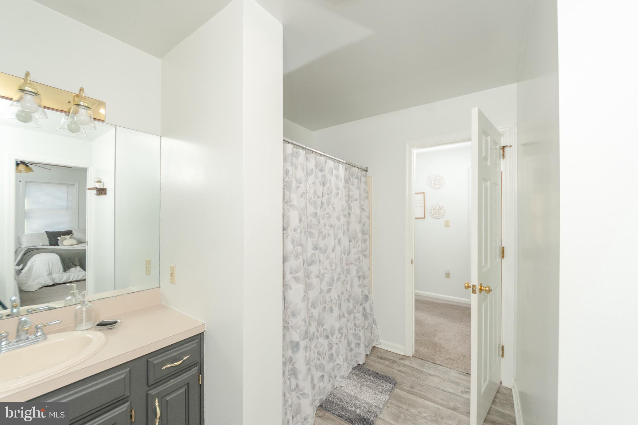 1553 White Oak Road Strasburg, PA 17579 - Photo 26 of 52 a bathroom with a shower sink and mirror