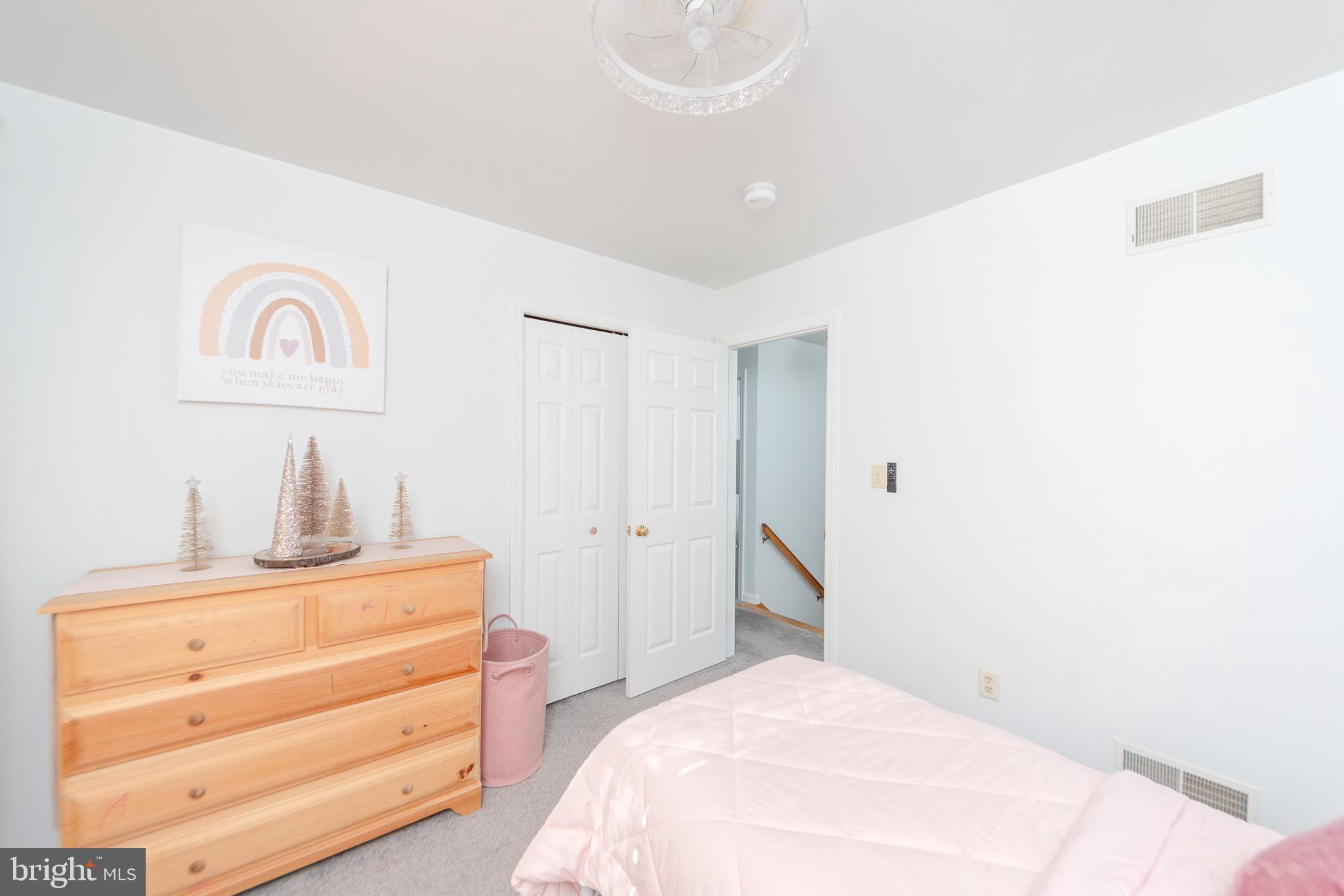 1553 White Oak Road Strasburg, PA 17579 - Photo 30 of 52 a bedroom with a bed and a mirror